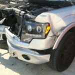 Before and after photographs of a damaged Ford pickup truck that was repaired by Elite Paint & Body Shop in West Palm Beach, Florida.